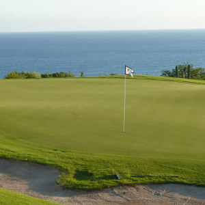 From a blind Tee Shot, you approach this spectacular Green on the Norman side of Puerto Los Cabos